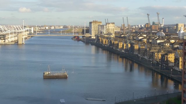 Dolly view of the Royal Victoria Dock and the Excel Exhibition center in London