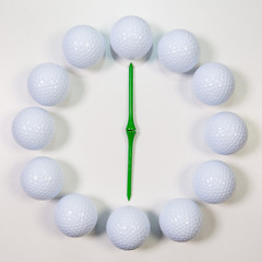 The clock of golf balls and wooden tees