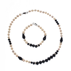 set of bracelet and beads on white background