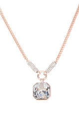 gold pendant with gem on a white background