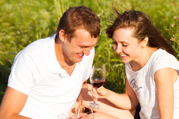 Portrait of a happy couple in love relaxing on a picnic outdoor