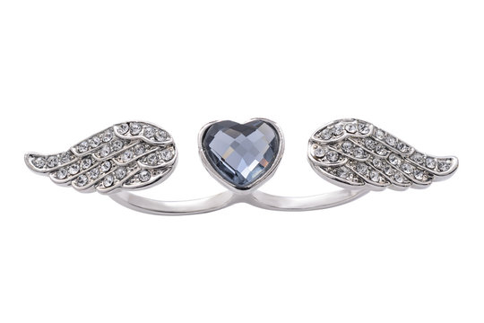 Silver ring with heart and wings on a white background