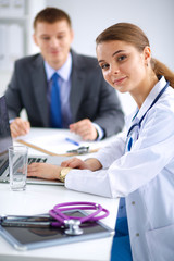 Fototapeta premium Medical team sitting at the table in modern hospital