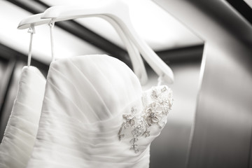 bride detail dress on a hanger