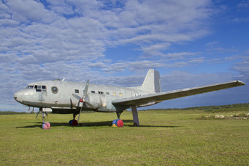 Fototapeta na wymiar obsolete aircraft on green field