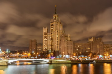 High-rise building on Kotelnicheskaya embankment in Moscow at night.