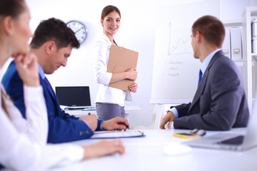 Business people shaking hands, finishing up a meeting, in office