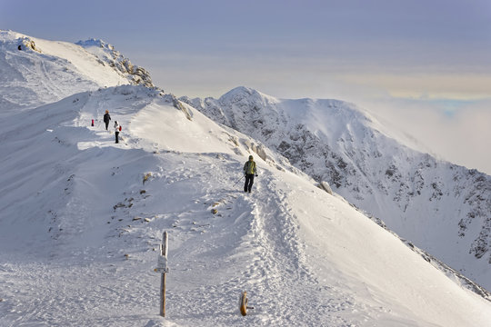 People on top of Kasprowy Wierch in Zakopane in Tatras in winter