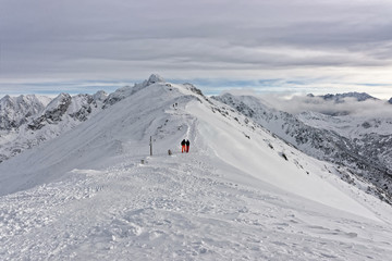 People climbing on Kasprowy Wierch in Zakopane on Tatras in winter