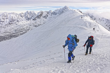 People climbing on Kasprowy Wierch of Zakopane on Tatras in winter