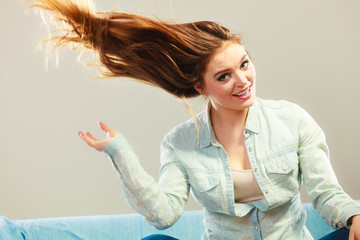 Fashionable girl with long hair blowing