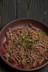 Buckwheat noodles with beef into a bowl, Thai