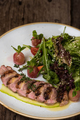 Meatloaf with lettuce, basil, arugula and sesame