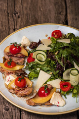 Salad with pork and bacon with cheese pate