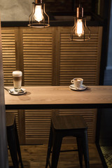 Coffee drink standing on a wooden table