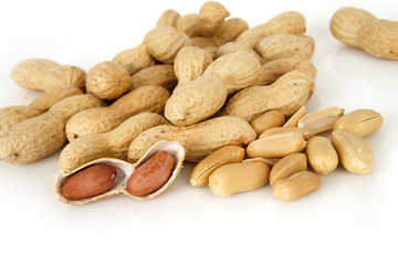 peanuts on a white background with shell