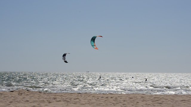 Kite surfing in waves. Splash. Chipiona, the city in Andalusia, Spain.