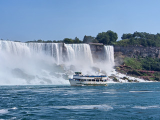Niagara Falls with tour boat viewed from the river