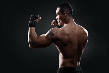 Fighter boxer on black background