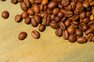 Coffee beans on wood background