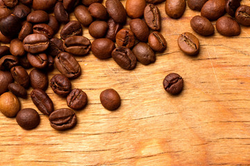Coffee beans on wood background