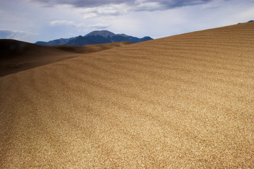 Fototapeta premium Thunderstorm over sand dunes