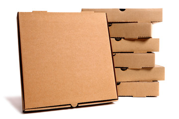 Stack of brown pizza boxes with display box top closed isolated on white background photo