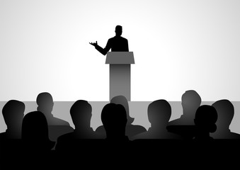 Man Giving A Speech On Stage