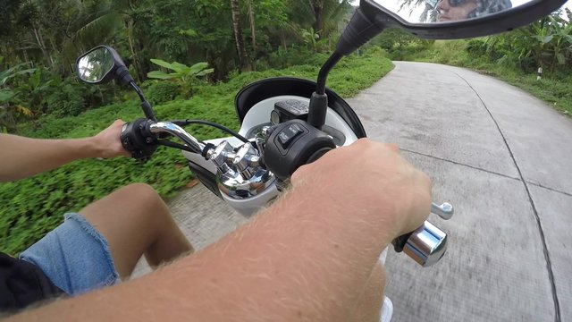 2.7K Man in Helmet Riding Scooter on Asphalt Road 