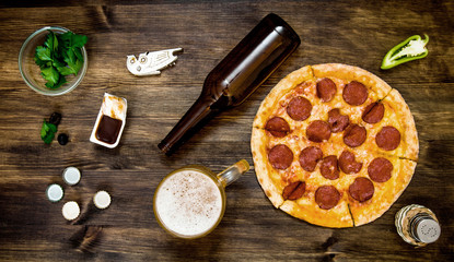 Objects for  pizza party. On a wooden table.