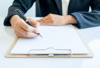Asian business woman using laptop for online shopping. Vintage tone retro filter effect, soft focus, low light. (selective focus)