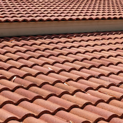 brown tile roof weathered on building residential