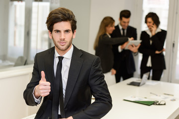 Business leader looking at camera in working environment