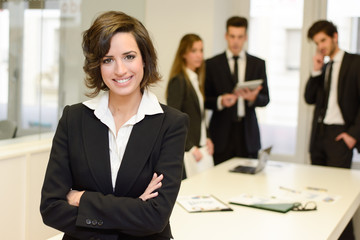 Business leader looking at camera in working environment
