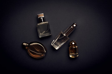 different perfume bottles on the dark background