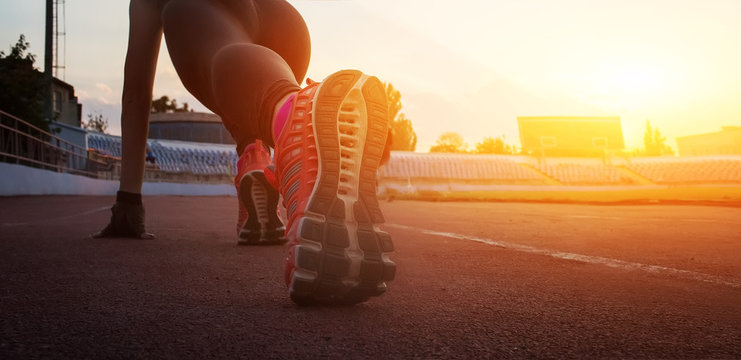Athlete runner feet running on treadmill closeup on shoe