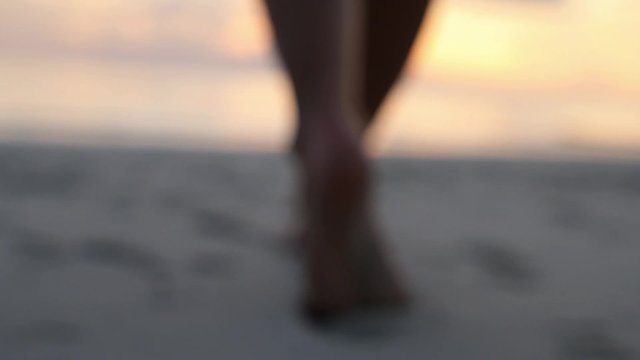 Footprint on Sand - Female Feet Walking at Sunset on Beach