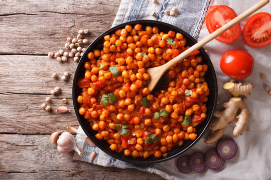 Indian Chana masala with ingredients. horizontal top view
