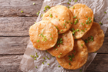 Indian Cuisine: Puri paper on the table. Horizontal top view
