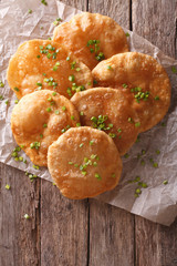 Indian Cuisine: Puri paper on the table. Vertical top view
