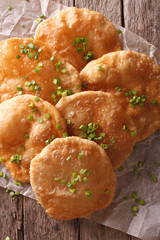 Indian puri bread on the table. vertical top view

