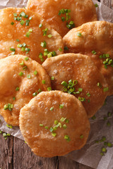Indian puri bread close-up on the table. vertical top view
