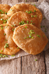 Indian puri bread close-up on the table. vertical
