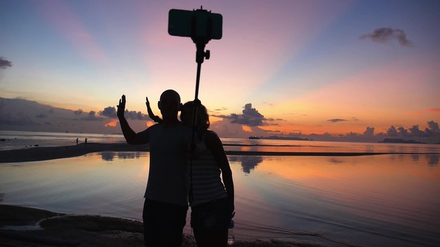 Couple of Best Friends Taking Selfie During Sunset by Phone