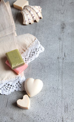 Handmade soaps, elegant towel, shell.