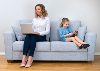 Mother and daughter spending time together. Modern family concept.