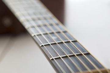 Acoustic guitar on wooden background