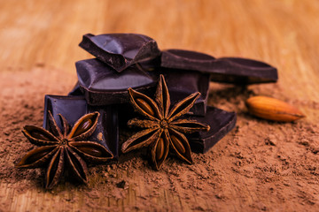 chocolate and star anise on rustic table