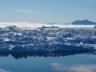 Antarctica iceberg and ice floe landscape © amheruko