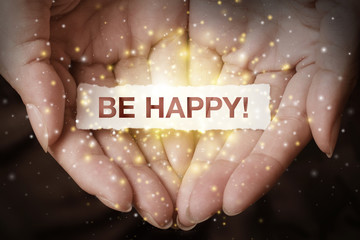 Be happy text on hand